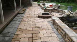 stamped concrete patio with firepit is being installed in va beach